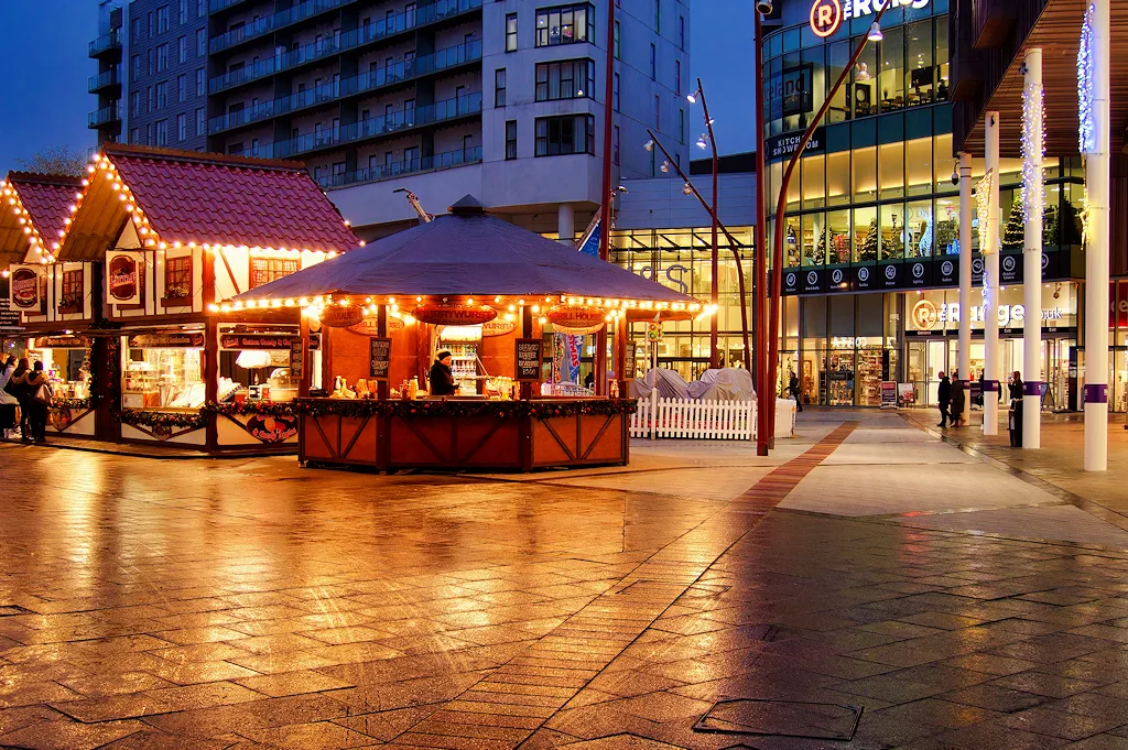 Christmas food fair stalls in St John's Square at The Rock, where the centre's free grotto stood last year