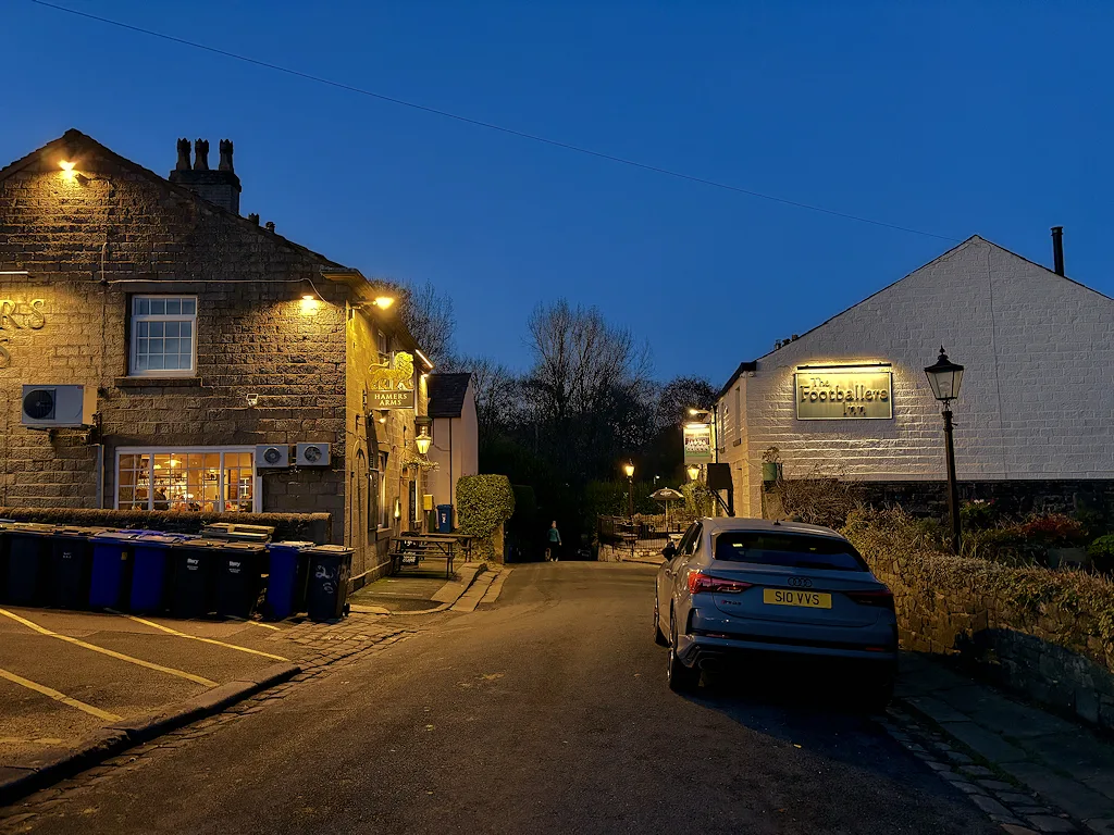 The Hamers Arms, left, and the Footballers Inn on Higher Summerseat in the evening
